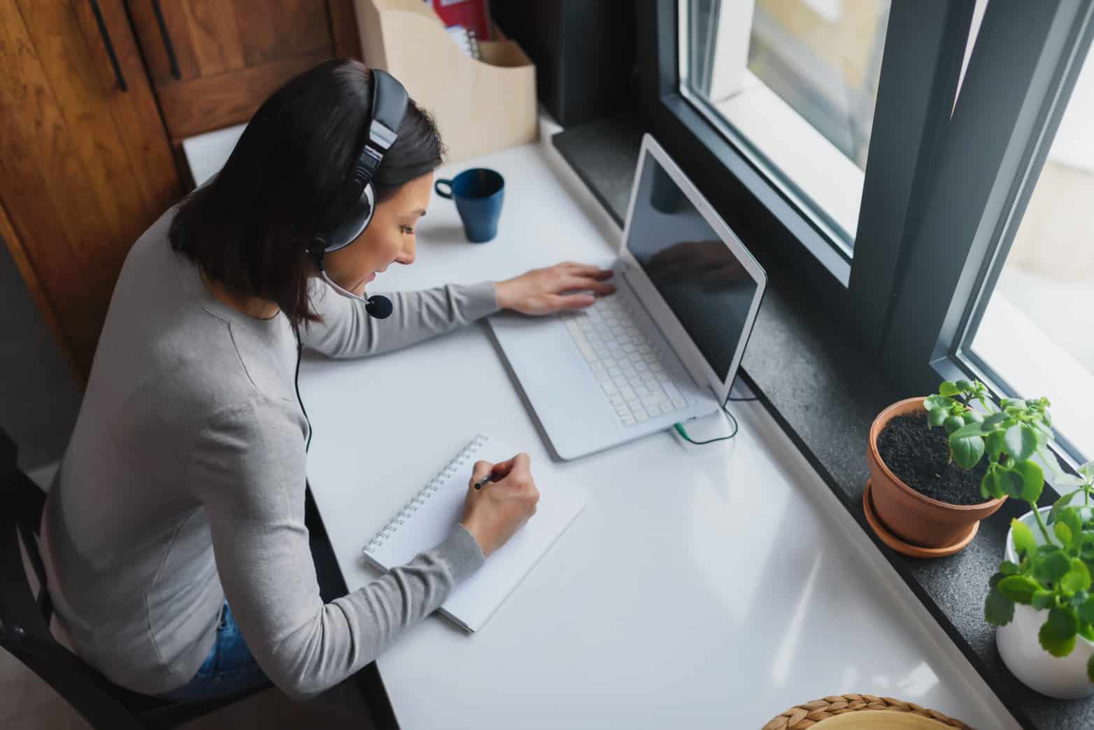 Teacher working at a laptop